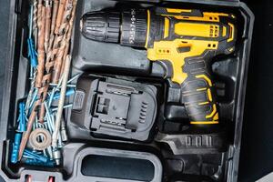 Cordless Drill in Toolbox with Accessories photo
