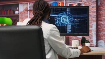 Freelancing computer engineer doing maintenance on artificial intelligence systems. Remote tech support specialist at working from home, doing checkup on AI systems, happy with results, camera B video