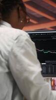 Vertical Happy day trader using PC, feeling satisfied after purchasing well performing stocks and selling at a profit. Cheerful forex trader joyous after making money with stock exchange portfolio, camera B video