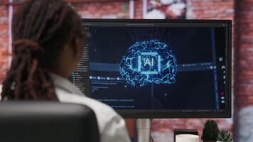 Programmer using computer at home for artificial intelligence computing simulating human brain through self learning algorithms. Employee working with AI deep neural networks on desktop PC, camera B video