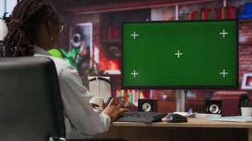 Teleworker using green screen PC in home office to write emails. Remote worker typing on mockup computer keyboard, composing documents in order to deliver finalized project paperwork, camera B video
