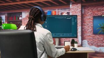 Graphic designer designing UX for AI software turning text prompt into photos. IT specialist drinking coffee using machine learning tech to build text to image models, camera B video