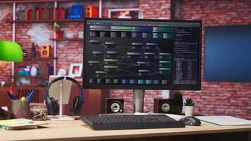 Software development being done on PC, implementing algorithms. Machine learning app on computer screen in home office used for building applications and optimizing performance video