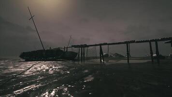 Derelict ship near an abandoned pier during a cloudy day with fog video