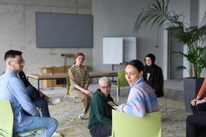 A diverse group of business professionals sits attentively in a modern office, actively participating in a training session led by an instructor, focusing on the latest technological advancements in photo