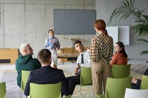A diverse group of business professionals sits attentively in a modern office, actively participating in a training session led by an instructor, focusing on the latest technological advancements in photo
