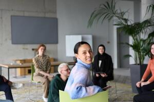 A diverse group of business professionals sits attentively in a modern office, actively participating in a training session led by an instructor, focusing on the latest technological advancements in photo