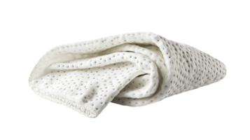 Soft textured blanket draped elegantly on a surface in a well-lit indoor setting during daytime. png