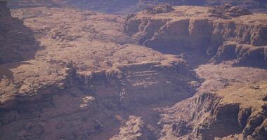 Vast canyon landscape under a clear sky during daytime exploration video