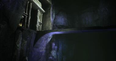 Exploring a mysterious underground cavern with illuminated rock formations video