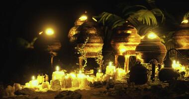 Illuminated pottery and candles create a mystical atmosphere at night video