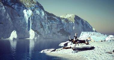 Serene coastal landscape with cliffs and calm waters during twilight hours video