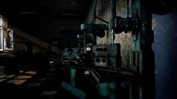Abandoned workshop with machinery and worn walls in dim lighting video