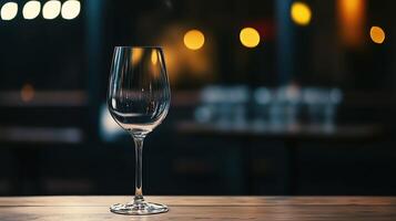 Elegant Empty Wine Glass on Wooden Table with Ambient Bokeh Lighting photo