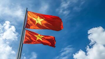 Majestic Twin Flags Waving in Blue Sky Symbolizing Unity and National Pride photo