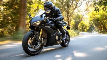 Motorcyclist in Full Gear Speeding on a Scenic Road Surrounded by Lush Greenery photo