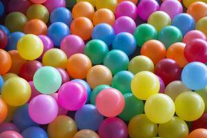 Top view colorful plastic balls in a dry pool. Playground for children's holiday party concept photo