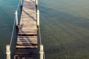 Wooden platforms, docks, or docks along the river hung with a rope photo