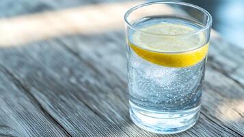 Crisp Lemon Infused Sparkling Water in a Glass for Natural and Healthy Refreshment photo