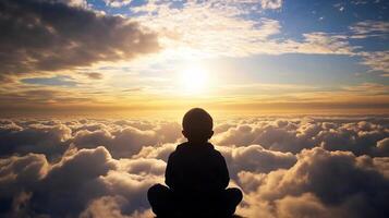 Silhouette of Child Sitting on Clouds at Sunset Serenity and Wonder photo