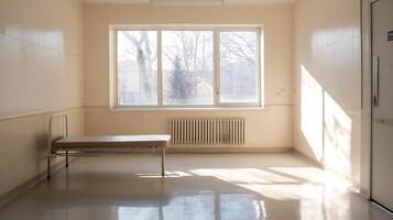 Sunlit Empty Hospital Room with Single Bed and Large Window Creating a Serene Atmosphere photo