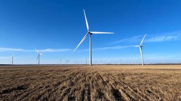 Field of Wind Turbines Harnessing Renewable Energy Under Clear Blue Skies photo