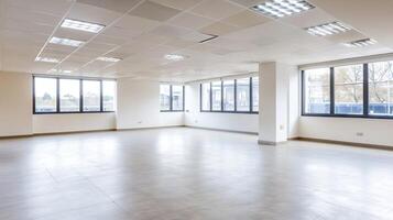 Spacious Empty Office Space with Ample Natural Light and Modern Ceiling Design photo