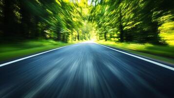 Dynamic Perspective of Fast Moving Road with Green Forest Surroundings photo