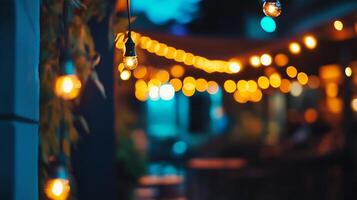 String Lights Creating Warm Ambiance in Outdoor Night Setting with Bokeh photo
