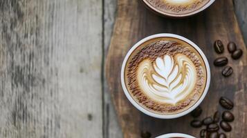 Top View of Latte Art in Cups on Rustic Wooden Table with Coffee Beans photo