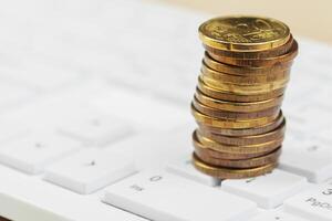 stack of coins and calculator,concept idea for business finance photo