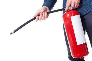Man using fire extinguisher isolated on white photo