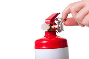 Man using fire extinguisher isolated on white photo
