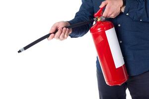 Man using fire extinguisher isolated on white photo