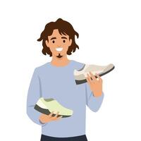 Cheerful man holding two different shoes, thoughtfully deciding on the best option. vector