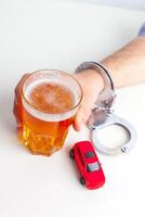 Drunk Driving Concept - Beer, Keys and Handcuffs photo