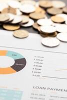 Graph Of Stock Market With Stacks Of Coins photo