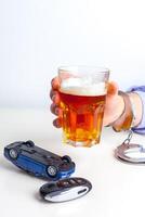 Drunk Driving Concept - Beer, Keys and Handcuffs photo