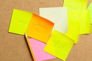 notes on corkboard background photo