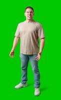 Man expressing intense frustration while standing against a bright green background photo