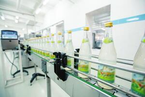 Bottled beverage production in a modern factory setting with a focus on conveyor line operations photo