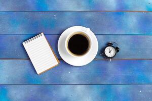 Mockup for check list, empty note paper with coffee cup on blue wood background. photo