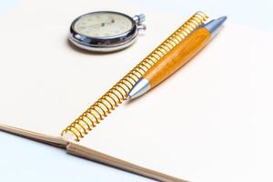 blank notepad for Todo list with pen and clock photo
