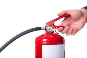Man using fire extinguisher isolated on white photo