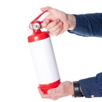 Man using fire extinguisher isolated on white photo
