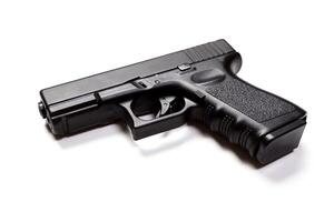 hand gun isolated on white background photo
