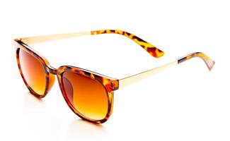 Sunglasses in leopard frame isolated on white background photo