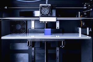 head of 3d printer in action photo
