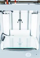 3d printer with bright red filament. photo