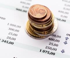 Graph Of Stock Market With Stacks Of Coins photo